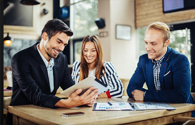 Data services team consulting with a business owner.